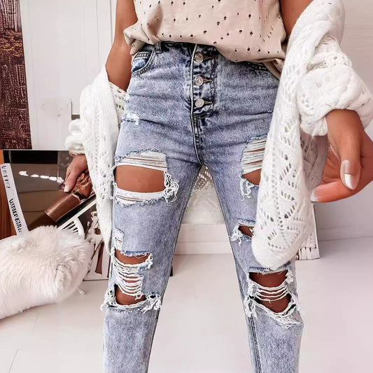 Boyfriendjeans dam med hög midja och knappgylf | Kraftigt slitna med revor | Uppvikta ben | Ljusblå med vintagekänsla