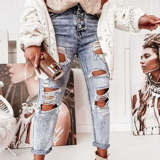 Boyfriendjeans dam med hög midja och knappgylf | Kraftigt slitna med revor | Uppvikta ben | Ljusblå med vintagekänsla